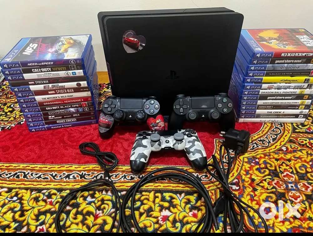 PlayStation 4 Slim 2TB With 3
Controllers & 17 Games Disc