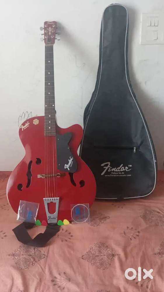 a Givson Crown Special acoustic guitar with picks extra strings cover