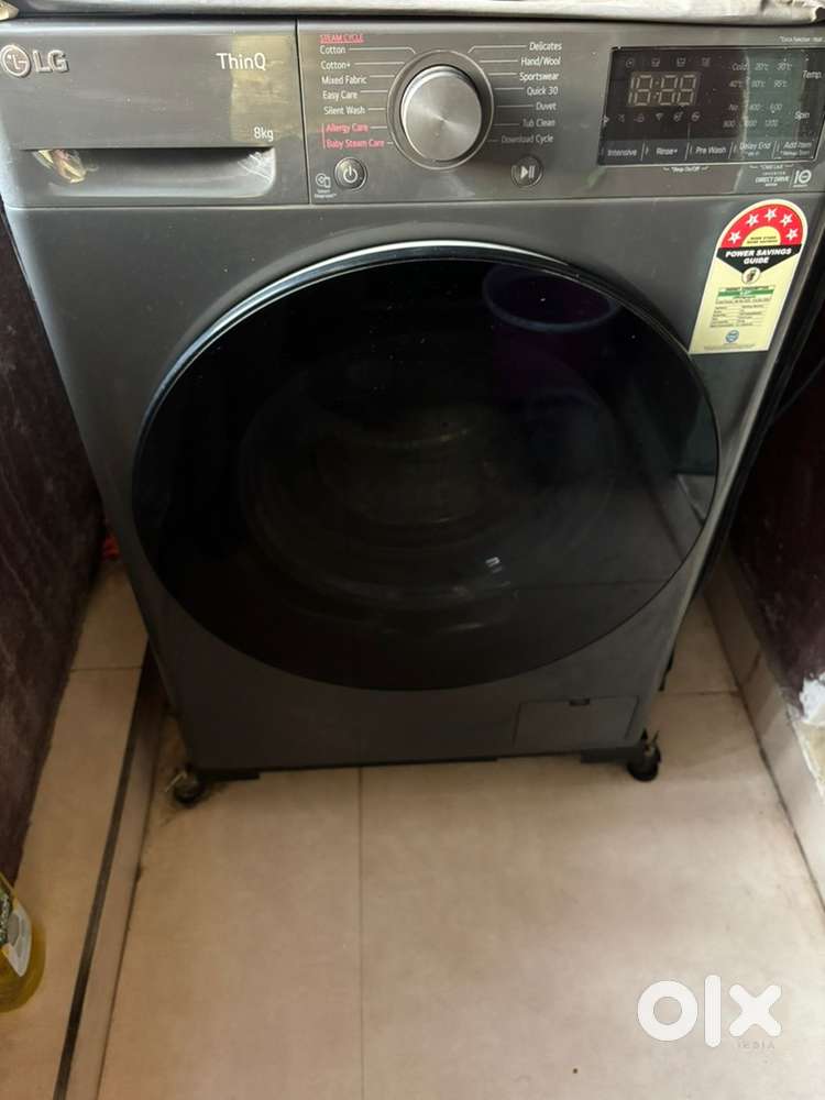 LG Front Load 8kg Smart Washing Machine with cover and metal stand