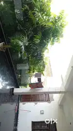 Separate bathroom with room and glass railing balcony