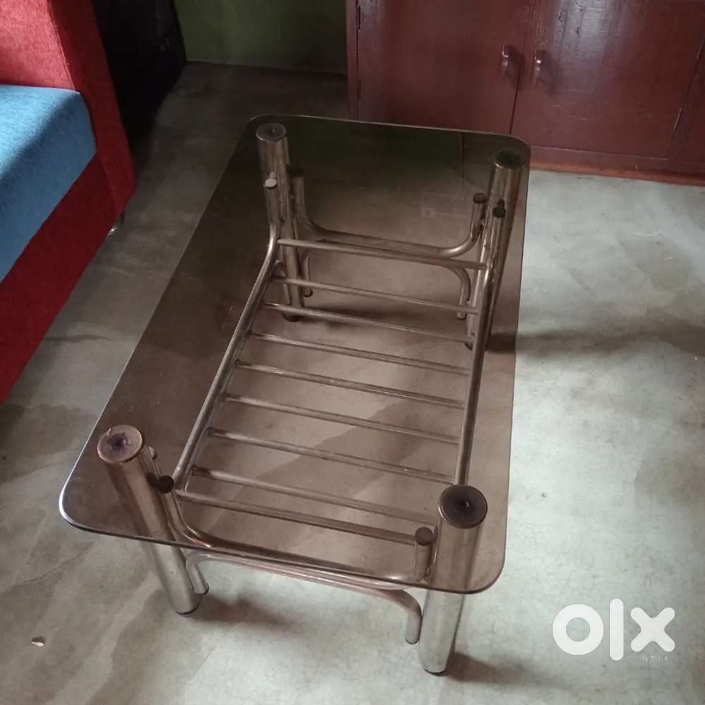 Black glass with still tea table