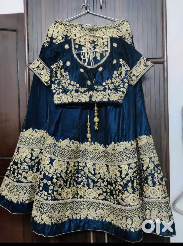 Designer Lehengas . bottle green one time used only.