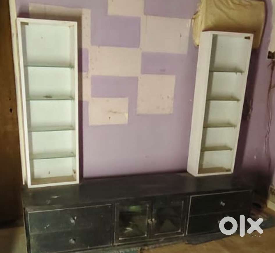 Tv unit with storage and two tall glass storage