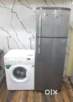 Whirlpool double door refrigerator and lg front load washing machine $