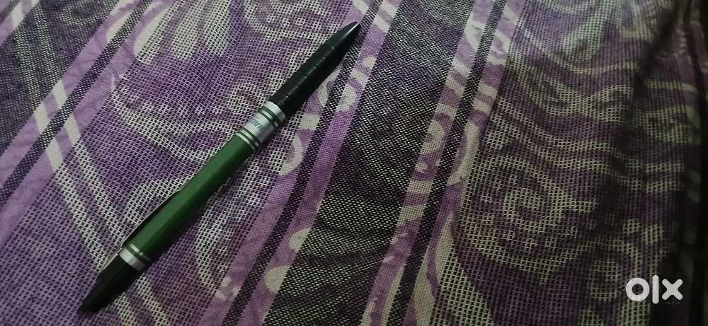Stastionry , blue ball pen, pen body colour is green and these is mst