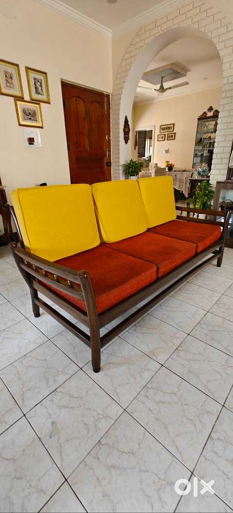One Teak wood three seater sofa