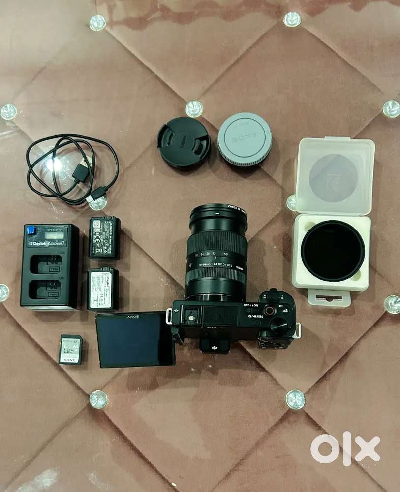 Sony Zvel0 + Sigma 18-50mm 2.8 lens + Nd filter & Batter & Charger