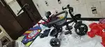 Baby tricycle with parental push handle
