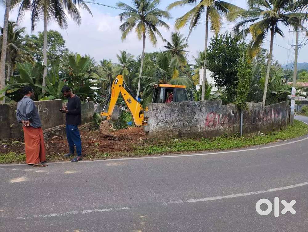 4 cent plot 5.25 per cent powdikkonam tar road frontage