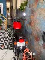 Red color bike with black alloy wheels