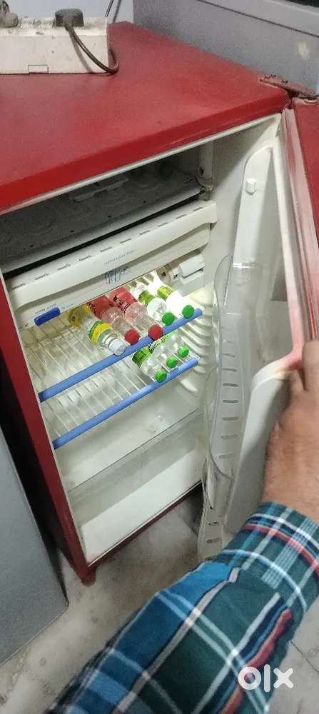 Red colour single door fridge good cooling