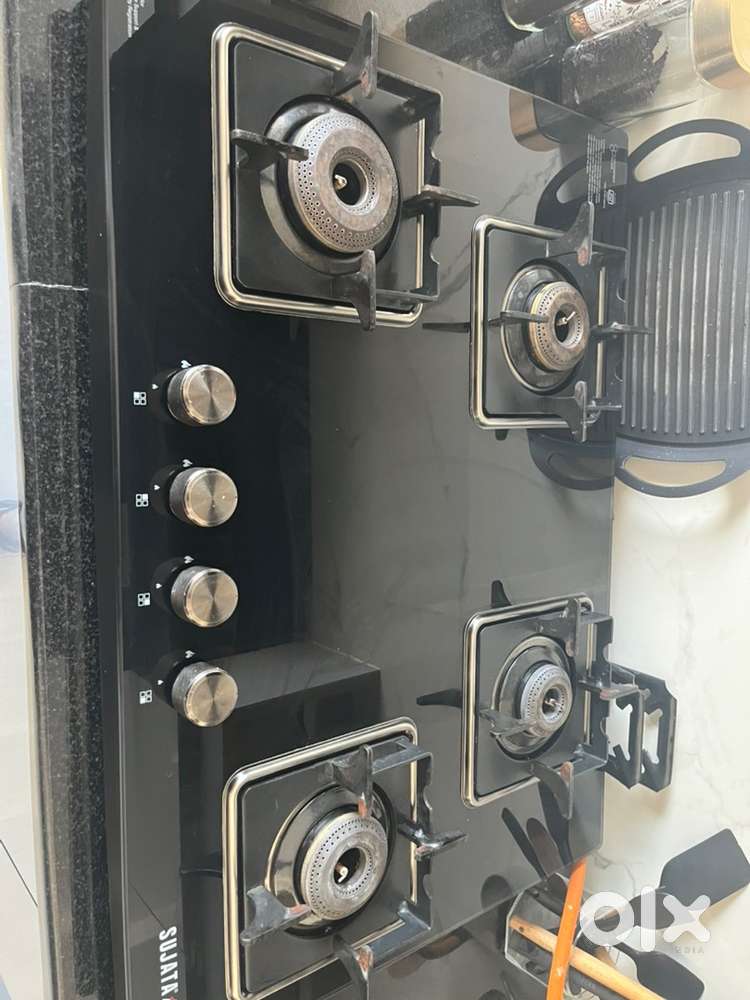 Sujata 4 burner gas stove and Faber Chimney