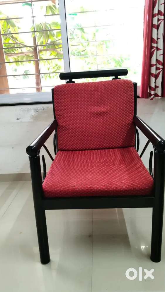 Comfortable metal sofa with two metal chairs.