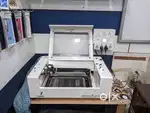Daqin CO2 Laser Cutting Engraving Mobile Skin Tempered Glass Machine