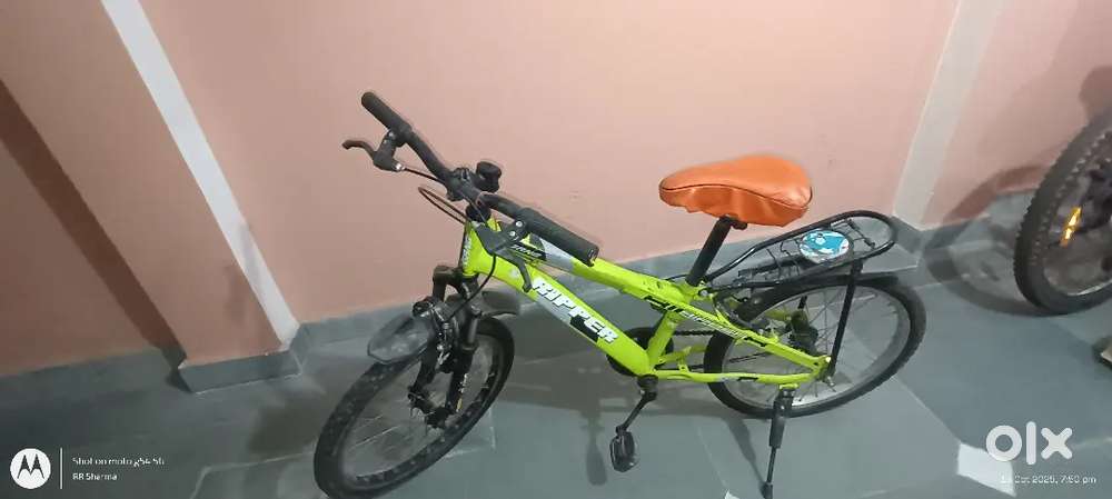 Bicycle , green colour with carrier