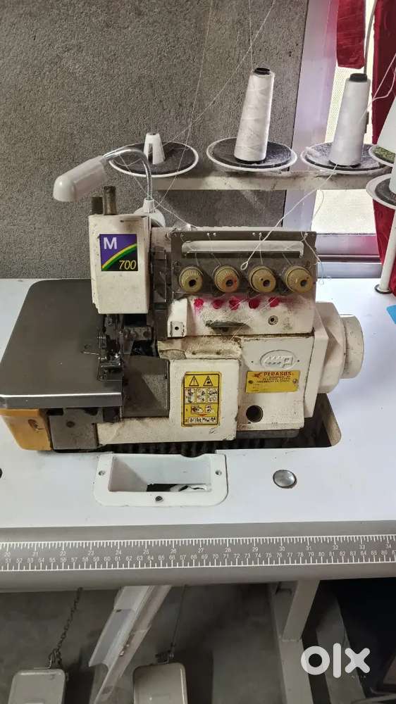 5 thread interlock swing machine 12000/-