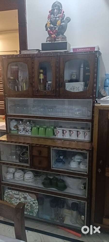All Wood dining almirah,with rollers n good condition