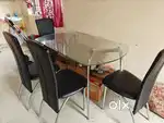 4 seater glass dining table with 4 chairs available for sale