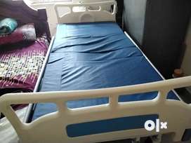 Adjustable bed for patients with mattress