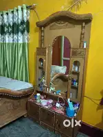 Wooden bed with a dressing table