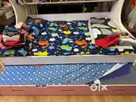Kids pull along bed with storage for sale