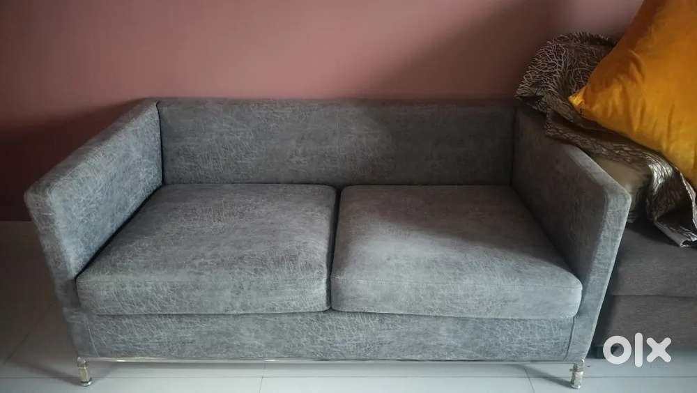 Urgently selling hardly used two seater Leather sofa in just rs 12000