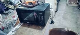 Black colour microwave oven with grill proper working