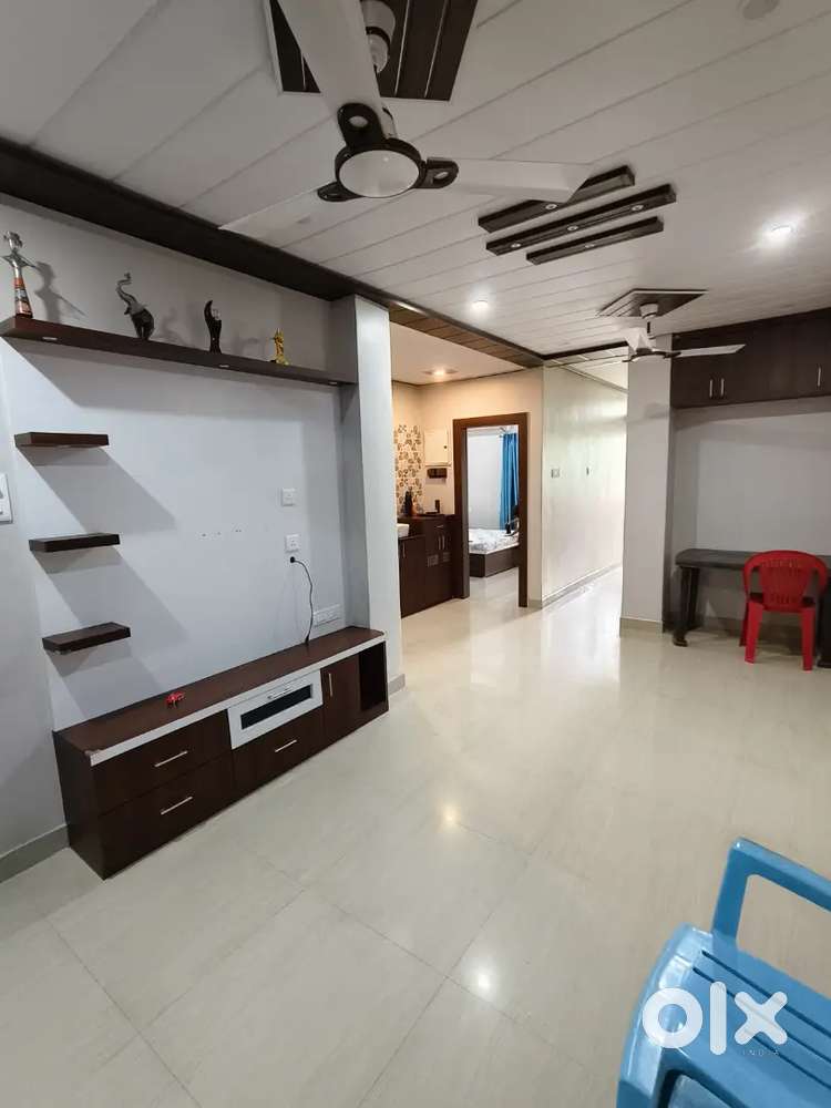 2bhk flat for rent with AC, bed, wardrobe and Puja room.