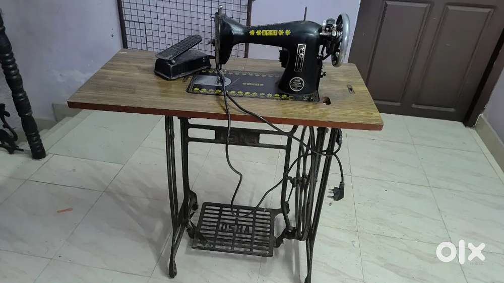 Stitching machine with motor
