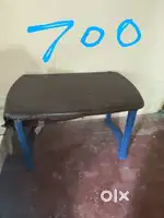 One wooden cot (2 plastic tables) 1 wood table  (near housing board)