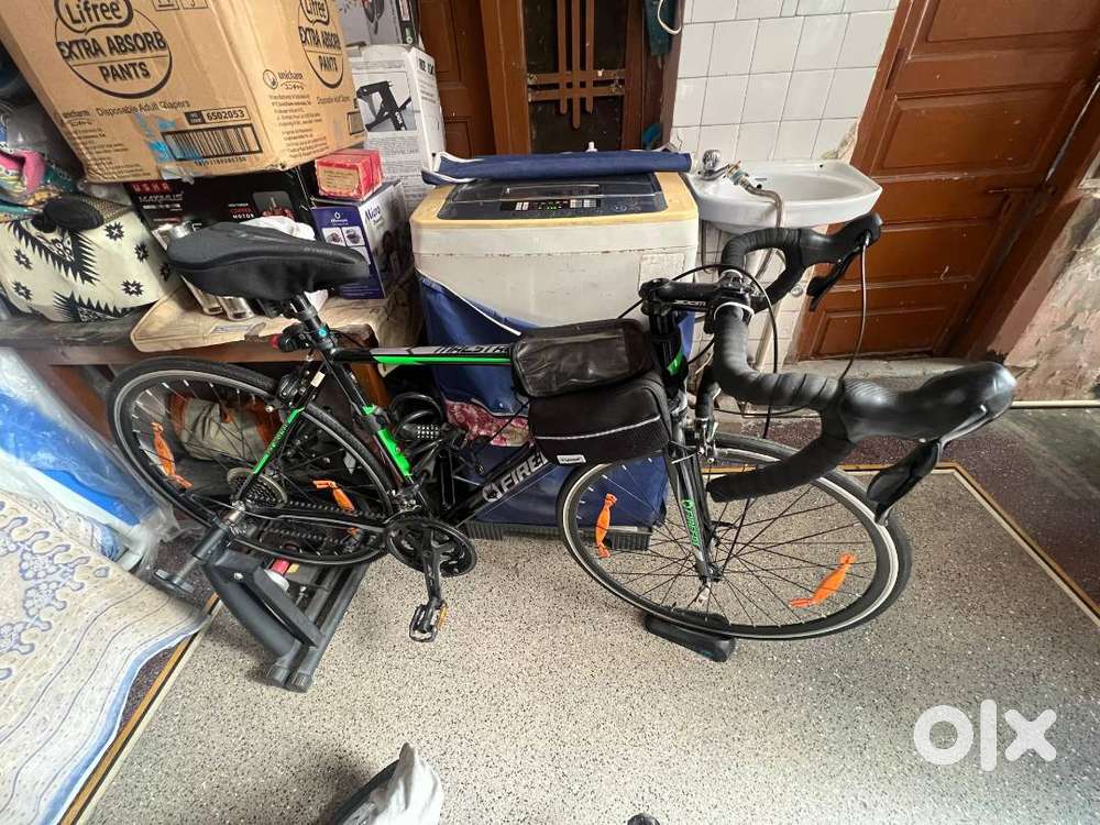 Firefox Mastero road bike with accessories and  in-door trainerstand