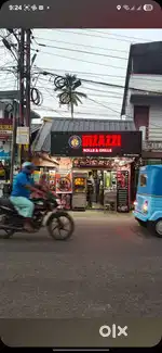 Main road facing, dual exit 4.4 cent land, with functioning hotel.