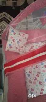 Cotton baby bed with mosquito net.