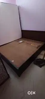 King size cot with hydraulic storage.