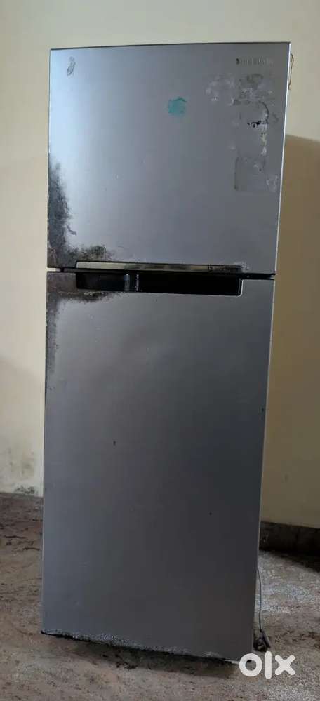 Double door fridge for sale - fully functional, small damage.