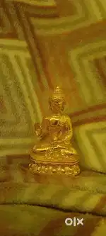 Golden coloured Buddha statue small Decorative item