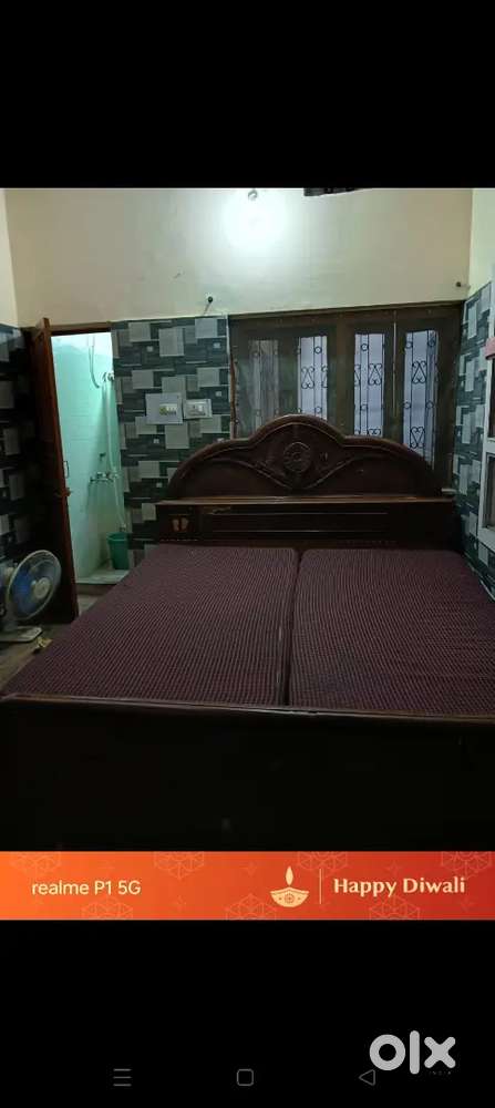 Double bed with washing machine