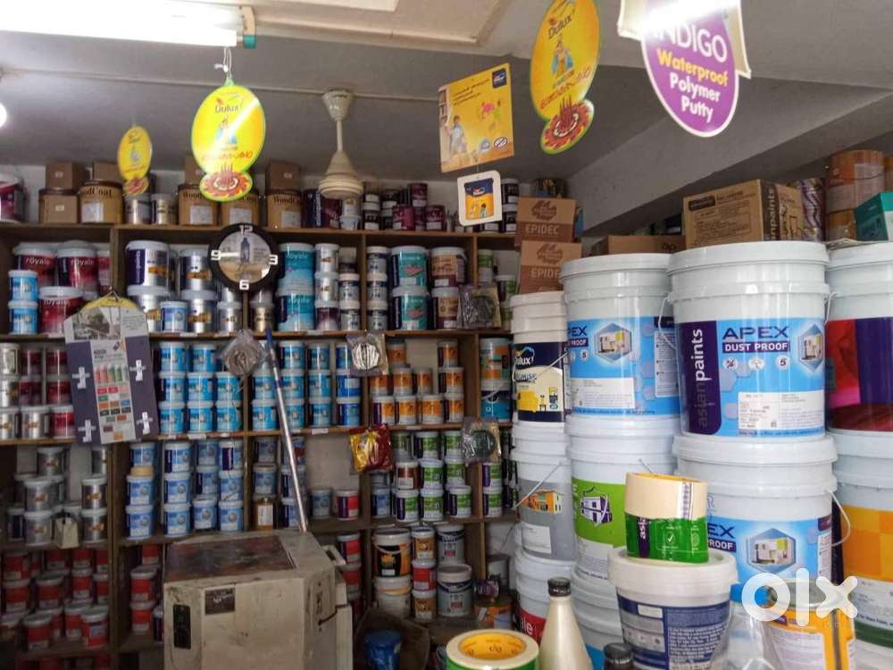 SALESMAN IN PAINT SHOP