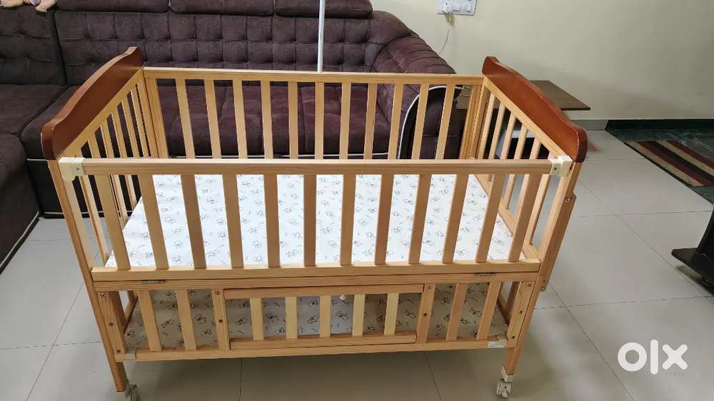 Babyhug wooden cot for babies with storage and mosquito net