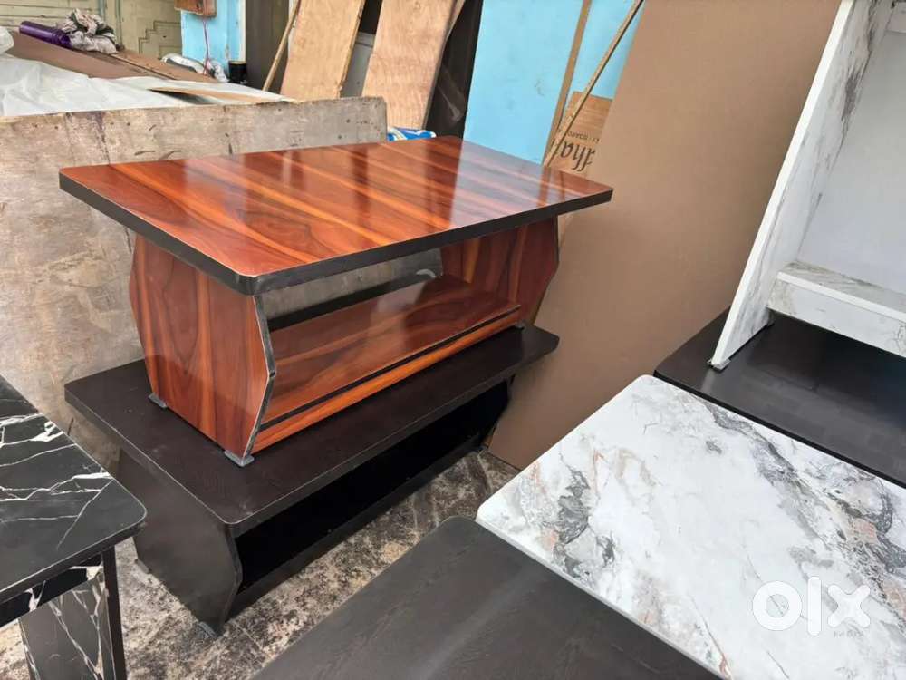 Wooden unused new center table 48*24 inches available