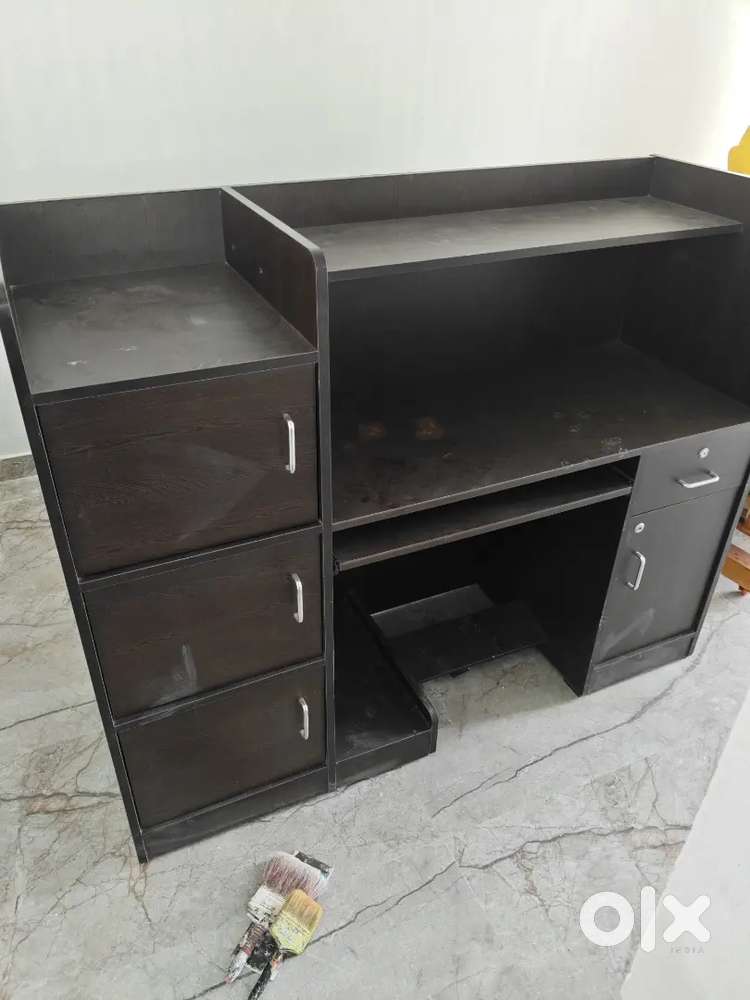 Study table with full of racks and computer table