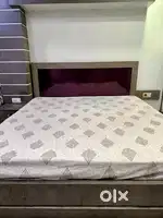 A COOL STYLISH DOUBLE BED WITH SIDE DRAWER AND WITH INTERNAL STORAGE