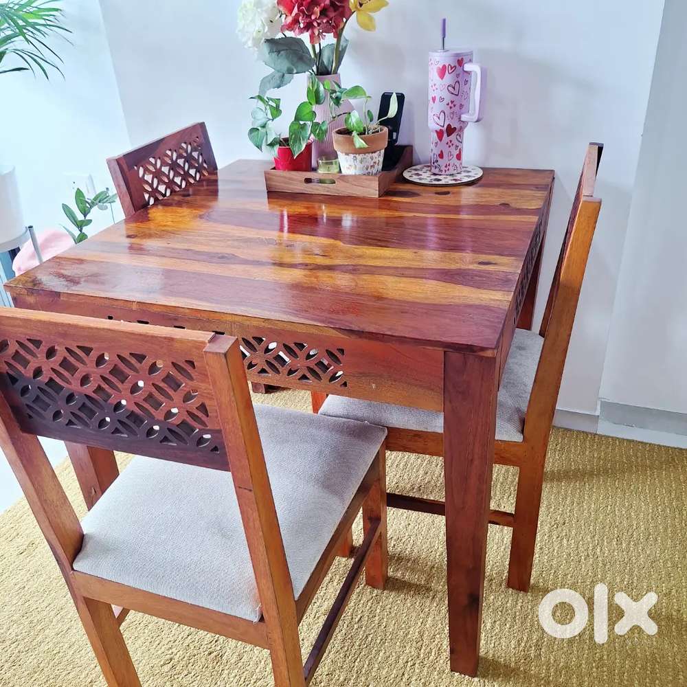 4 seater solid Teak Wood Dining Table with 4 cushioned chairs.