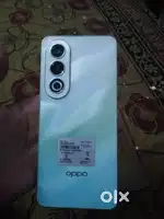 An oppo mobile phone with box and charger and bill