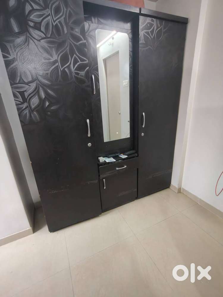 Table 2nos,wardrobe 1no,steel cupboard 1no