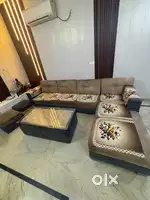 Modern sofa set L shaped with 3 puffs and glass table