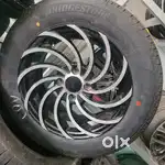 swift alloy wheels with brand new  BRIDGESTONE TYRE UNCONDITIONAL