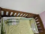 Baby Cot bed with it's bedding and cushions