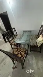 6 seatee dining table with glass top