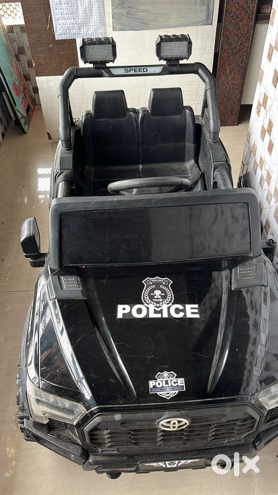 Kids ride on police truck